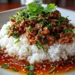 Close-up of homemade Honey Garlic Ground Turkey on white plate