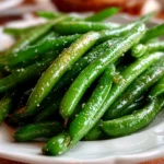 Fresh green beans on white plate