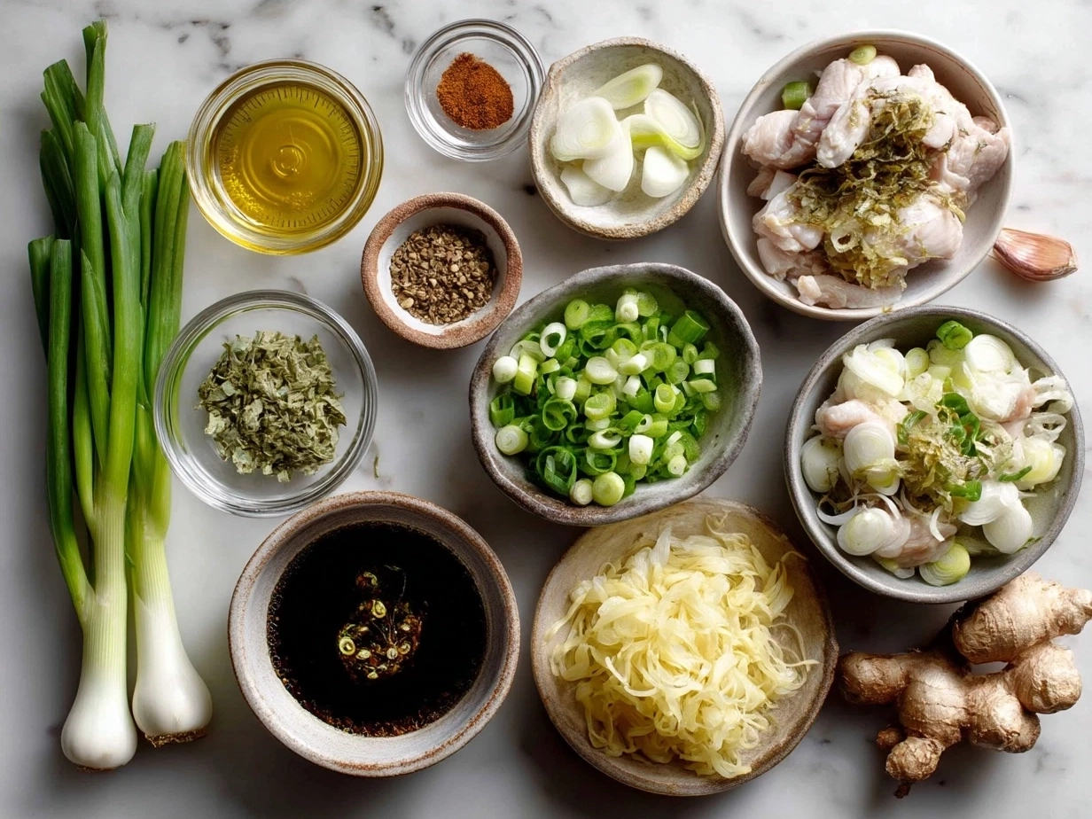 Ingredients for Ginger Scallion Chicken Noodle Soup including chicken thighs, ginger, scallions, garlic, soy sauce, noodles, and broth